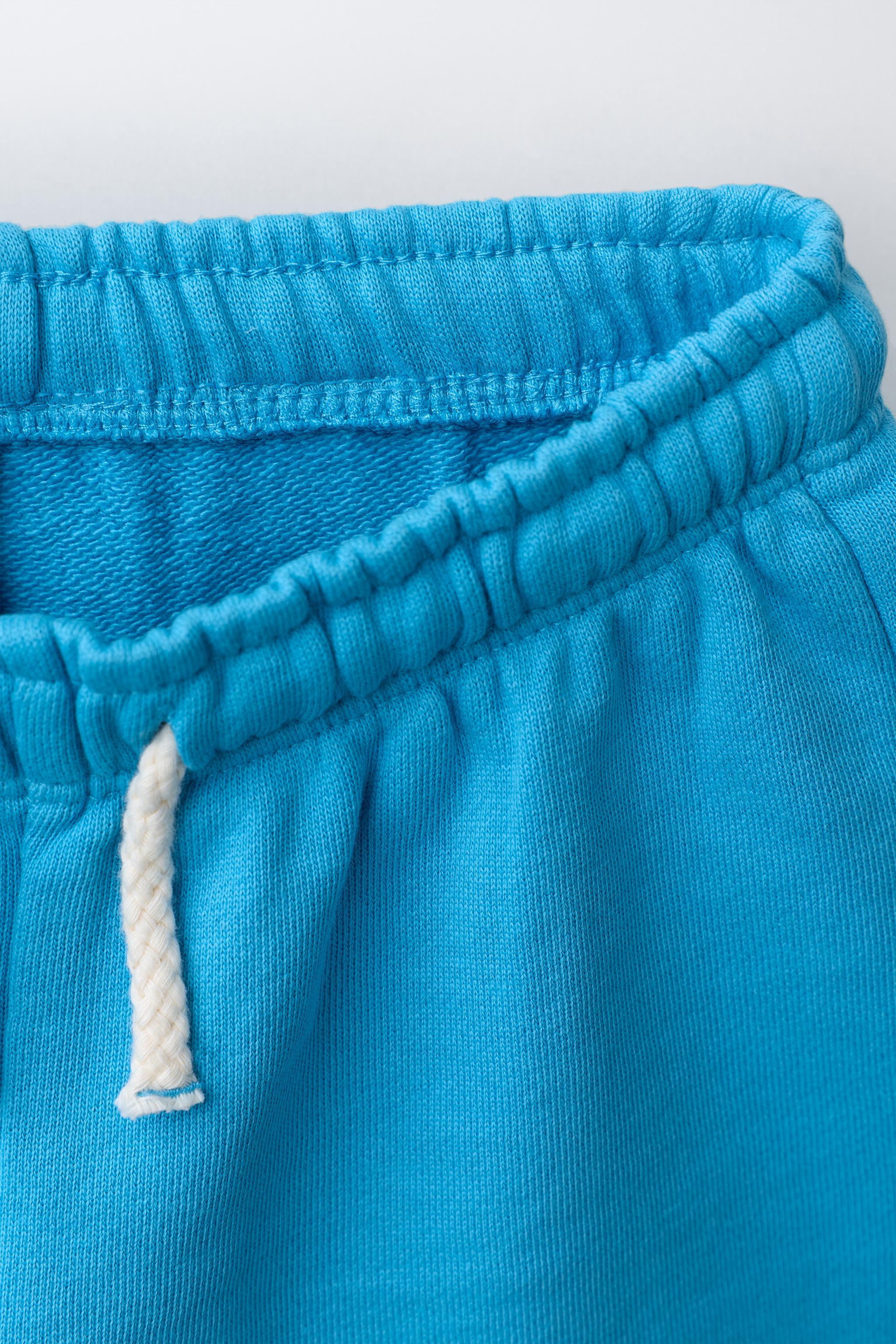 ENSEMBLE SWEAT ET BERMUDA À FLEUR GOMMÉE